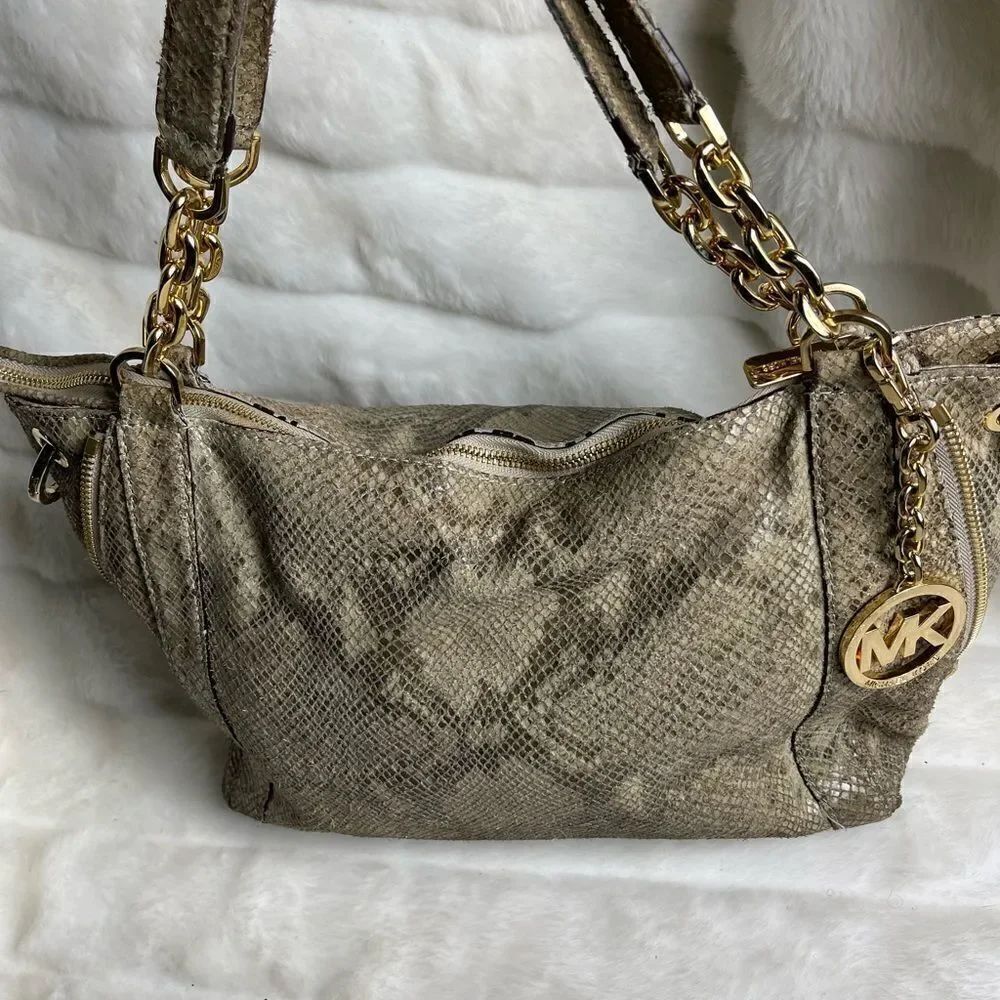Michael Kors snake skin tote  taupe color with gold tone accents and hardwares